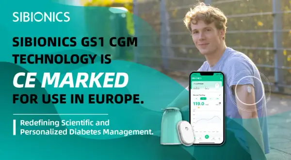 Młody mężczyzna z czujnikiem SIBIONICS GS1 na ramieniu, prezentujący technologię CGM. Aplikacja na telefonie pokazuje dane o glukozie.
